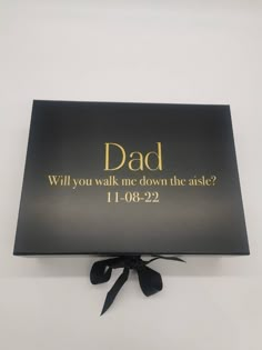 a black box with gold lettering that says dad will you walk me down the aisle?