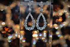 A ladies pair of stunning 18 karat white gold diamond teardrop shape dangle earrings set with 42 round brilliant cut diamonds having a total weight of 1.75 carats. Diamond Fashion Jewelry, Diamond Fashion, Round Brilliant Cut Diamond, Brilliant Cut Diamond, Round Brilliant Cut, Teardrop Earrings, White Gold Diamonds, Earrings Set, Round Brilliant