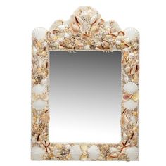 a mirror with shells on it and a shell border around the frame, in white