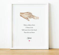 a framed print with an image of two hands holding each other and the words granny above it