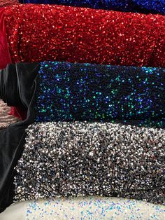 many different colors of sequins are stacked on top of each other