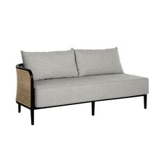 a gray couch sitting on top of a wooden frame