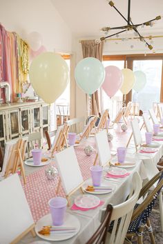 a birthday party with pink and white decorations