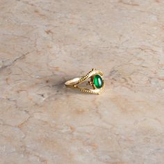 Immerse yourself in the playful elegance and unique design of our handmade boho ring with green onyx in a golden look. This exquisite piece of jewelry combines the vibrant beauty of a green onyx with a noble brass setting. Each ring is made with the utmost care to ensure the highest quality and a distinctive look. Our boho ring with green onyx is not just an accessory, but an expression of style and individuality in a boho and vintage look. The playful design makes this ring a real eye-catcher t Elegant Green Opal Ring In 14k Gold, Adjustable Fit Emerald Ring, Handmade May Birthstone Ring, Adjustable Elegant Jade Rings, Green Dainty Crystal Ring With Birthstone, Bohemian Gold Jewelry With Green Onyx, Bohemian Green Onyx Gold Jewelry, Gold Plated May Birthstone Ring, Dainty Gold Emerald Ring For May Birthstone