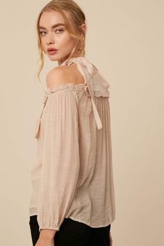 Show your springtime spirit with this darling cold shoulder blouse💐 -Color: Champagne -Linen textured -Halter neck -Cold shoulder with long puff sleeves -Elasticized on sleeve opening -Tie strap on neck -Chiffon contrast on chest and back -Ruffle on chest -Model is 5' 10" 33-24-35 and wearing a size Small Summer Long Sleeve Off-shoulder Top With Blouson Sleeves, Summer Off-shoulder Top With Blouson Sleeves, Chic Spring Puff Sleeve Top With Tie Sleeves, Spring Feminine Off-shoulder Blouse, Feminine Off-shoulder Blouse For Spring, Casual Off-shoulder Blouse With Blouson Sleeves, Chic Peasant Top With Lantern Sleeves For Spring, Chic Peasant Top With Balloon Sleeves For Day Out, Chic Long Sleeve Peasant Top For Brunch