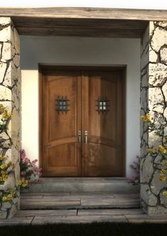 two wooden doors in front of a stone building with flowers growing on the side walk