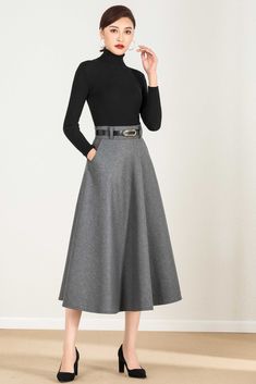 "Fluidity and elegance from this chic winter skirt. Team the wool skirt with a chunky sweater, winter boots, no matter what the weather throws at you! DETAIL * 30% wool, 30% fiber, 40% polyester * polyester lining * Two side pockets * Right zipper closure * Below knee length effect * Perfect for autumn winter * It will include a belt (not same with the model wear) * Lean More about the items From the FAQs on the page bottom SIZE GUIDE Size vary between Brand and Country Please get your body meas Elegant Wool Bottoms For Winter, Elegant Winter Midi Bottoms, Elegant Midi Length Winter Bottoms, Elegant Midi Length Bottoms For Winter, Chic Long Skirt Bottoms For Winter, Winter Workwear Skirt, Winter Workwear Bottoms In Midi Length, Fitted Denim Skirt For Winter, Black Pleated Skirt For Winter