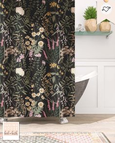 the shower curtain is decorated with flowers and plants