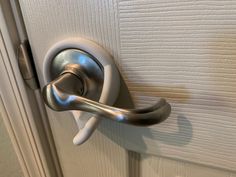 a door handle on a white door