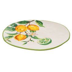 a plate with lemons and leaves painted on it