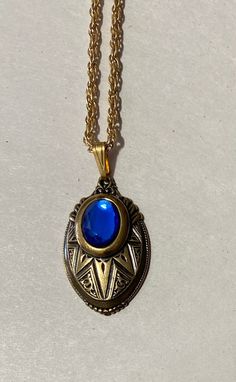 "This is for a beautiful layered Victorian Look Pendant. Oval Brass pendant with a Blue color Glass stone accent 1 1/2\" long x 1\" wide Inspired by the \"Golden Era\" 23\" gold Plate rope Chain Thanks for looking" Antique Blue Jewelry With Large Pendant, Antique Blue Brass Jewelry, Antique Blue Metal Jewelry, Blue Medallion Locket Necklace, Blue Oval Locket Necklace, Oval Blue Locket Necklace, Antique Blue Oval Pendant Jewelry, Formal Blue Locket Jewelry, Adjustable Blue Medallion Necklace