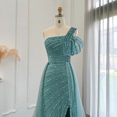 This one-shoulder evening dress radiates luxury and elegance with its sage green color and exquisite design. Perfect for weddings, formal events, and parties, this dress combines style and sophistication. Look and feel like royalty in the beautiful and unique luxury Dubai dress. window.adminAccountId=244214477; Luxury Light Blue Tulle Evening Dress, Luxury Light Blue Embellished Evening Dress, Orange Evening Dresses, Luxury Blue One-shoulder Asymmetrical Dress, Luxury Turquoise V-neck Dress, Elegant Turquoise Floor-length Evening Dress, Yellow Evening Dresses, Silver Evening Dress, Purple Evening Dress