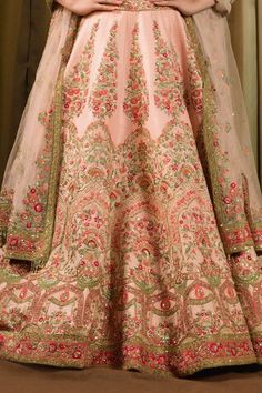 Pink bridal lehenga featuring thread embroidered floral vine motifs, embellished with sequins and beads. Paired with a padded blouse and a matching dupatta with bead tassels., Fit: Relaxed Sequin, Floral Vine, Beaded Tassels, Bridal Lehenga, Embroidered Silk, Raw Silk, Aza Fashion, Lehenga, Thread