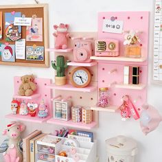 there is a pink shelf with many items on it and a teddy bear in the corner