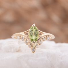 "Vintage style victorian womens wedding ring, Antique 14k solid yellow gold marquise cut green peridot engagement ring, Promise ring for her WE OFFER UNLIMITED PERIOD INSTALLMENTS PLAN This is a beautiful, stunning, feminine ring that works well for all occasions, styles, and ages. You will love it! Ring information Main stone: Peridot Approximate size: 8x4mm Accent stones: White cubic zirconia Approximate size: 1.5mm (5 stones) Approximate size: 1.25mm (4 stones) Metal type: Gold Metal stamp: 1 Green Marquise Diamond Ring Fine Jewelry, Green Marquise Diamond Ring For Formal Occasions, Green Marquise Diamond Ring For Formal Events, Classic Wedding Diamond Ring With Peridot, Formal Green Marquise Diamond Ring, Green Marquise Ring With Diamond Accents, Green Marquise Rings With Diamond Accents, Classic Marquise May Birthstone Jewelry, Green Marquise Diamond Promise Ring