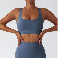 75% Nylon . 25% Spandex Built-in Bra Classic racerback design Designs with a rounded U-shape neckline. Soft. comfortable. skin friendly 4-way stretch. breathable and sweat-wicking Perfect for both sports activities and daily life