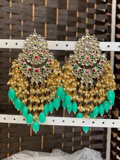 Hand painted meena earring . Push back. Approximately 5 inch long Bohemian Kundan Danglers With Stone Work, Bohemian Kundan Earrings With Stone Work, Traditional Green Beaded Earrings For Festivals, Green Kundan Drop Danglers, Green Kundan Drop Dangler Earrings, Green Kundan Drop Earrings, Green Kundan Earrings With Stone Work, Handmade Kundan Chandbalis In Bohemian Style, Handmade Bohemian Kundan Danglers