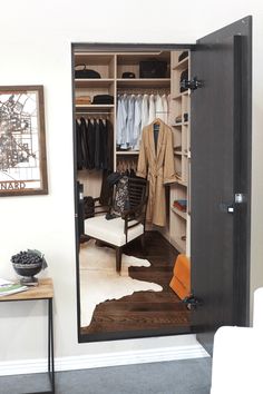 an open closet with clothes and other items