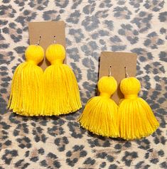 These stylish Tassel Earrings are the perfect accessory for any outfit. Made from high quality materials, these earrings are both durable and lightweight. With their elegant design and colorful tassels, they add a fun and playful touch to your look. Whether you're dressing up for a special occasion or just adding some flair to your everyday outfit, these earrings are sure to impress. Key Features: - High quality materials - Lightweight design - Elegant and colorful tassels - Perfect accessory fo Trendy Fringe Earrings As A Gift, Trendy Fringe Drop Earrings, Yellow Tassel Earrings For Summer Gift, Trendy Tassel Earrings, Yellow Fringe Tassel Earrings, Adjustable Beaded Tassel Earrings, Trendy Tassel Drop Earrings, Yellow Dangle Tassel Earrings For Party, Trendy Tassel Drop Earrings With Fringe