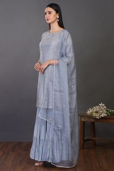 Look your best on festive occasions in this elegant doctor blue embroidered silk sharara suit. It comes with a matching dupatta. Shop online from Pure Elegance. Disclaimer: The actual product may vary slightly from the image. These are custom orders, hence expect slight variation in color, placement of the motif or buta. ESTIMATED DELIVERYBecause this is a custom order, it would take about 4 weeks from the date of purchase. RETURN POLICYThis product is a custom order and cannot be returned or exchanged. Blue Embroidered Sharara For Designer Wear, Blue Embroidered Chanderi Sharara, Blue Floor-length Sharara With Chikankari Embroidery, Floor-length Blue Sharara With Chikankari Embroidery, Semi-stitched Blue Chanderi Sharara, Unstitched Blue Sharara With Gota Work, Blue Dola Silk Palazzo Set With Straight Kurta, Blue Floor-length Sets With Chikankari Embroidery, Blue Semi-stitched Sharara With Dori Work