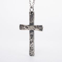 This large sized Tradition Cross is handmade of solid 925 sterling silver (92.5% pure silver) in my studio. It is hand hammered and given a dark patina to create the old vintage rustic look. Cross size: 2 1/4 inches (5.5 cm) x 1 1/4 inches (3.5 cm) Necklace chain: choose your length Sterling Silver Oxidized Crucifix Necklace, Oxidized Sterling Silver Cross Pendant Necklace, Spiritual Silver Cross Necklace With Oxidized Finish, Spiritual Hammered Cross Necklace, Antique Silver Sterling Silver Cross Necklace, Silver Hand Forged Cross Pendant Jewelry, Antique Silver Cross Necklace In Sterling Silver, Hand Forged Silver Cross Pendant Jewelry, Hand Forged Silver Cross Pendant Necklace