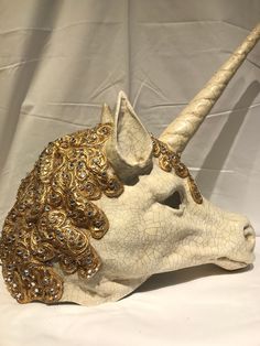 Unicorn Baroque Mask This Unicorn Mask is made with tecnique of macrame. Burano lace with gold leaf and more than 300 swarovski. There is craquele tecnique with oil color Traditional and original papier-mache Venetian mask, handmade. All our masks are handmade in our stores located in Venice. Our decorators use techniques typical of the Venetian tradition such as stucco, acrylics, gold and silver-leaf, macramè, passemenerie, pearls and crequelè to give you a wide range of masks. This shape is av Juliet Ballet, Clowns Vintage, Unicorn Mask, Venice Mask, Venetian Mask, Oil Color, The Venetian, Vintage Circus, Costume Mask