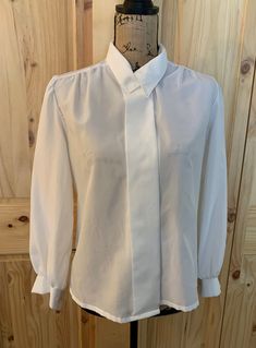 "100% polyester  Hidden front button closure  2 button cuff  Shoulder to shoulder 16.5\" Sleeve length 22\" Blouse length 22.5\" Bust 38\" Chart size small  1970 Excellent vintage condition" White Long Sleeve Blouse, Blouse Length, White Long Sleeve, Womens Clothing Tops, Sleeve Blouse, Blouses For Women, Long Sleeve Blouse, Blouses, Tops & Tees