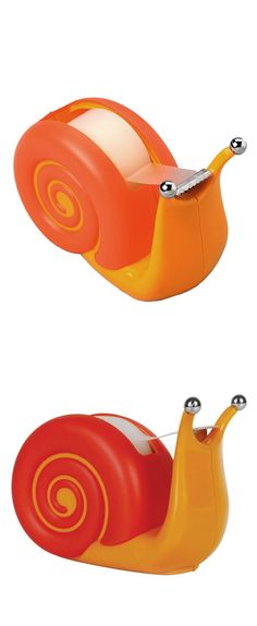 an orange and red snail toy sitting next to each other