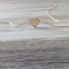 Cute gold necklace with a tiny heart charm hangs on a delicate 14k gold filled chain .This necklace is perfect for yourself, giving as a special gift.Necklace Measures Approximately 17"Tiny heard bead- 7 mmMade from 14k gold filled .If you would like this chain altered, please convo me. All my jewelry are packed in an elegant gift box.If you want to give it as a gift you can specify the address and I'll be happy to send it on your behalf. Cute Gold Necklace, Heart Necklace Gold, Gold Heart Necklace, Tiny Heart, Data Storage, Gold Heart, Gold Filled Chain, Heart Of Gold, Elegant Gift