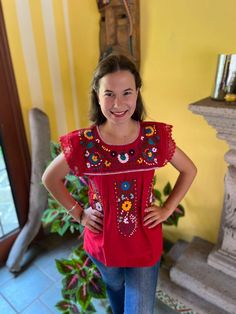 Beautiful Mexican blouse with floral style hand embroidery and lace details on the cuff. Each blouse is embroidered by hand and they are unique pieces so colors may vary. Mexican textile art has centuries of history and creativity throughout the country. Mexico is recognized as one of the leading countries with a beautiful artistic production in the textile world, miraculous hands of talented artisans from different states of the country create stunning embroidery clothing, and various items. #Oaxaca #Chiapas We ship anywhere in the word, from Tepic, Nayarit,  mx. Made by artisans from Oaxaca, Mx We recommend washing by hand with cold water, tender in the shade, to better preserve the original color. Red Embroidered Blouse For Festivals, Red Blouse With Embroidered Border For Festivals, Bohemian Embroidered Top With Multicolor Floral Embroidery, Bohemian Embroidered Top With Multicolor Floral Design, Bohemian Multicolor Floral Embroidered Top, Bohemian Blouse With Embroidered Hem For Festivals, Traditional Blouse With Embroidered Sleeves, Bohemian Resham Embroidery Top For Festival, Bohemian Resham Embroidered Top For Festival