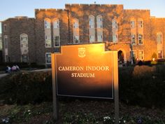 a sign in front of a building that says camera indoor stadium on it's side