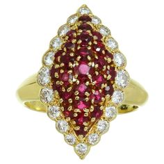 This fabulous Van Cleef & Arpels ring is crafted in 18k yellow gold and features a marquise design set with round red rubies weighing an estimated 1.29 carats and brilliant-cut round E-F VVS1-VVS2 diamonds weighing an estimated 0.66 carats. Made in France circa 1980s. Measurements: 0.51" (13mm) width, 0.90" (23mm) length. The ring size is 5.75 - EU 51. Resizable. Sizing fees will be provided upon request. Luxury Marquise Ruby Ring With Diamonds, Luxury Yellow Gold Ruby Ring With Marquise Cut, Luxury Yellow Gold Marquise Cut Ruby Ring, Luxury Marquise Cut Ruby Ring In Yellow Gold, Luxury Marquise Cut Yellow Gold Ruby Ring, Marquise Cluster Ring Hallmarked Fine Jewelry, Luxury Marquise Hallmarked Ring, Hallmarked Marquise Cluster Ring In Fine Jewelry Style, Luxury Hallmarked Marquise Ring