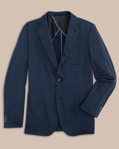 This blazer will instantly be your go-to formal coat. Lightweight and relaxed, you’ll feel polished yet comfortable all day long. Pair our navy men's blazer or khaki blazer with our Jack Pant for an elevated look. You can also pair with our Charleston Denim to provide added sophistication to a casual go-to. Fight the southern heat with built-in Coolpass technology and reduced lining for optimal breathability. Style: 7242 Classic Navy Blazer For Business Casual, Classic Navy Sport Coat For Business Casual, Formal Solid Sport Coat With Welt Pockets, Navy Sport Coat With Patch Pockets For Work, Navy Sport Coat With Hidden Button Closure For Work, Business Blazer With Patch Pockets, Semi-formal Solid Blazer With Pockets, Semi-formal Blazer With Pockets, Navy Single Breasted Blazer For Business Casual