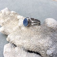 Here is a stunning piece of multi colored blue swirly sea glass from Seaham beach in England that I bezel set in fine silver to be the focal point of a double band of sterling silver. I then oxidized and polished it to bring out the beauty of the silver. It measures a US size 7.5. Own a piece of the ocean with this one of a kind ring. It will come in a little ribbon tied gift box perfect for that special someone. Thanks for looking :) Adjustable Sea Glass Ring Jewelry, Handmade Sea Glass Ring Jewelry, Handmade Adjustable Sea Glass Rings, Unique Blue Stackable Round Rings, Unique Blue Stackable Rings, Blue Round Stackable Rings, Unique Blue Cabochon Moonstone Ring, Unique Blue Moonstone Ring, Unique Blue Moonstone Cabochon Ring