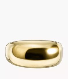 a gold wedding ring on a white background