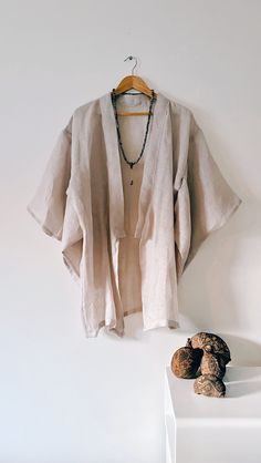 The 'Mala' Kimono  - is a one off a,  kind handmade kimono, created in delicate gentle woven linen, slightly transparentand perfectly suited for hot summer evenings.  If you are a lover of the finer things in life, then this one-off lustworthy piece of art could be the jewel of your wardrobe. A deliciously decadent robe dedicated for the dreamers and gypsies.  100% Linen - one size fits AU6 - AU12 -  is a short kimono just covers to the beginning of the thigh, below the buttock area If you aren't sure of the size, send me your measurements. Kimono hand made in Australia One of a kind creation Linen Wrap Kimono For Vacation, Vacation Linen Wrap Kimono, Linen Kimono With Relaxed Fit, Bohemian Linen Kimono For Vacation, Long Linen Kimono For Beach, Long Linen Kimono For Summer, Elegant Linen Kimono For Summer, Elegant Linen Summer Kimono, Summer Long Linen Kimono