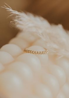 We love this chain ring worn individually for a simple adornment, or stacked for a stronger statement. 1.8mm band width. Available in 14kt Gold Fill. Due to the making process, this ring may run +/- 1/4 size. Paired on Jess with our Confetti Rings and Valley Trio. Handmade in Eau Claire, WI. Our jewelry is handmade so each piece will be unique and may vary slightly from what is pictured. Confetti Rings, Copper Uses, Everyday Wear Jewelry, Midi Rings, Cuff Rings, Jewelry Cleaner, Chain Ring, 14kt Gold, Confetti