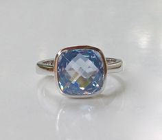 A minimalist classic Square Shaped Blue Quartz hand set in a bezel setting that elegantly holds the stone, featuring handcrafted in sterling silver. This beauty makes a great birthstone ring for those December Birthday gals and a great ring to stack with our other gemstone rings! Wrapped in a box ready for gift giving.(r-b-6) RING INFO ---------------- STERLING SILVER STONE SIZE 9MM (0.35inches) DECEMBER BIRTHSTONE Visit our Ring Section https://www.etsy.com/shop/Belesas?section_id=11187900& Elegant Blue Stackable Rings For Formal Occasions, Elegant Blue Gemstone Stackable Rings, Elegant Blue Stackable Birthstone Rings, Elegant Blue Birthstone Ring With Bezel Setting, Elegant Blue Birthstone Stackable Rings, Elegant Blue Stackable Rings With Bezel Setting, Blue Birthstone Ring With Bezel Setting For Formal Occasions, Formal Blue Birthstone Ring With Bezel Setting, Blue Stackable Rings For Formal Occasions