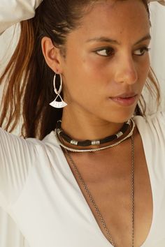 This Beautifully handcrafted choker necklace consists of 9 Tuareg Inspired motif beads. The Amari sits beautifully on it’s own, or layered to create a classy ethnic look for any occasion. You will want to wear this piece each and everyday. Includes extension chain for desired length . The Amari choker is a smaller beaded version to the Zaire choker ,if you would prefer this custom made with a different length please send me info via Dm . DETAILS :* Made from strong cotton rope string and High Quality white brass * Length of Black string with white Brass beads 33 cm* Length of extension chain 13 cm* Total length 46 cm* Width approx 1 cm* Weight 42 grams Jewelry Care : ✼ Jewelry will oxidise over time with everyday wear and exposure. Use a polishing cloth to restore shine . Avoid water and l Elegant Festival Jewelry With Oxidized Finish, Adjustable Jewelry With Dangling Beads For Festivals, Adjustable Dangling Beads Jewelry For Festivals, Dangling Beads Festival Jewelry, Adjustable Dangling Beads Choker, Elegant Dangle Choker For Festival, Festival Jewelry Long Necklace With Dangling Beads, Elegant Adjustable Choker With Dangling Beads, Black Fair Trade Jewelry For Festivals