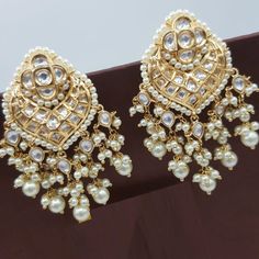 "Kundan Earring/Kundan Pearl Chandbali/Sabyasachi Kundan Jhumka/Chandbali earring/Kundan Indian wedding Jewelry/Bridal earring@AryaFashions Beautiful high quality semi precious stone Indian traditional Rajwadi Style Jadau Kundan Chandbali earrings for any occasion such as Wedding, Engagement, Baby Shower, evening party. These earrings are handcrafted with love and creativity and are perfect for any occasion may it be engagement, Wedding or any bridal ceremonies or social get-together. This set i Luxury Chandbali Bridal Earrings With Cutdana, Luxury Bridal Chandbali Earrings With Elegant Design, Kundan Cutdana Danglers For Reception, Reception Kundan Danglers With Cutdana Details, Kundan Jhumkas With Gota Work For Reception, Reception Kundan Cutdana Danglers, Festive Chandbalis With Gota Work For Reception, Festive Gota Work Chandbalis For Reception, Kundan Danglers With Stone Work For Reception