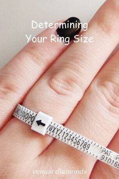 a woman's hand holding a measuring tape with the words determining your ring size