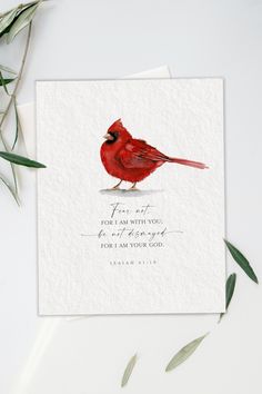 a red bird is sitting on top of a white card with the words, for me i am with you