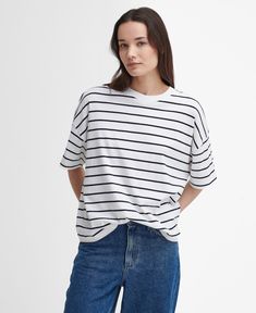 The Barbour Marnie Striped T-Shirt is a must-have style for laid-back days. This super-soft, yarn-dyed cotton t-shirt features short sleeves and dropped shoulders for a casual look, while the relaxed fit and woven logo patch the reverse ensures its made for everyday wear. Oversized T-shirt For Summer Casual Gatherings, Relaxed Striped Summer Tops, Relaxed Striped Tops For Summer, Striped Short Sleeve Crew Neck Top For Summer, Summer Striped Crew Neck Short Sleeve Top, Striped Crew Neck Short Sleeve Top For Summer, Trendy Striped T-shirt With Relaxed Fit, Summer T-shirt With Shirttail Hem For Everyday, Relaxed Fit T-shirt With Shirttail Hem For Day Out