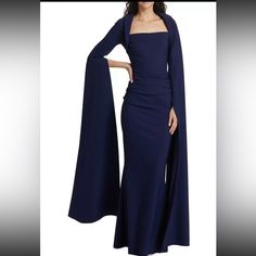 Beautiful Chiara Boni La Petite Robe Reiko Cape-Sleeve Gown In Classic Navy Size 14. Length Of Gown Has Been Altered To Reflect Height Of 5ft 4in With Shoes. Shoulder Pads Have Been Removed But Saved If Desired To Use. Paid $1090 At Saks. Selling $675.00 Worn Once-Mother Of The Bride Dress. Very Comfortable And Flattering. Chiara Boni La Petite Robe's Reiko Gown Is Crafted Of An Italian Stretch Blend And Features Elongated Cape Sleeves. This Fitted Piece Is Complete With A Bolero-Style Straight Neck And Ruching At The Waist. Bolero Straight Neck Long Sleeves Zip Closure 72% Polyamide/28% Elastane Dry Clean Made In Italy Self-Taught Designer Chiara Boni Began Petite Evening Gowns, Bolero Style, Bride Gown, Mother Of The Bride Gown, Chiara Boni, Sleeve Gown, Cape Sleeves, Bride Gowns, Gowns With Sleeves