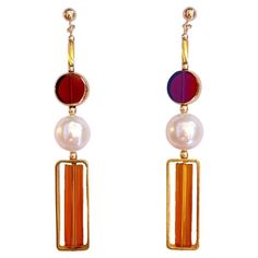 Red transparent vintage German glass beads edged with 24K gold are complimented with freshwater pearls with caramel glass bugle bead. The earrings are finished with gold filled earring post and 14K gold filled beads. The vintage German glass beads that are edged with 24K gold were hand pressed during the 1920s- 1960s. No two beads are exactly alike. These beads are no longer in production thus making them rare and highly collectible. Product Detail: - 24K gold edge glass Bead - Freshwater pearls 24 Karat Gold, Earring Post, Bugle Beads, Gold Filled Earrings, Red Vintage, Glass Bead, Vintage Stil, Post Earrings, Freshwater Pearls