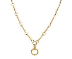 Whether worn alone or with an added pendant, this Foundrae necklace is a modern alternative to the traditional chain. The mid-length necklace is composed of Foundrae's signature golden element links. One chubby annex link hangs from the center of the clockweight pendulum pendant and opens, creating the perfect backdrop for one or more of your favorite Foundrae charms. total length : 24" : 18K yellow gold18K yellow gold chubby annex link : 1/2" diameter18K yellow gold lobster clasp closure Luxury Brass Chain Necklace With Round Pendant, Luxury Delicate Chain Brass Necklace, Luxury Brass Clavicle Chain Necklace, Luxury Hallmarked Pendant Chain Necklace, Luxury Yellow Gold Charm Necklace With Clavicle Chain, Luxury Brass Pendant Chain Necklace, Luxury Gold Nickel-free Necklace, Luxury Yellow Gold Clavicle Charm Necklace, Luxury Brass Chain Necklace For Everyday