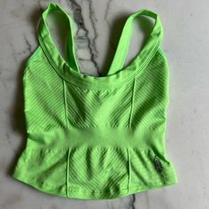 Brand: Fp Movement By Free People Style: Cinched Textured Sports Bra Cami Top Color: Lime Green Size: Xsmall/Small Condition: Never Worn Seamless Green Tops For Gym, Green Seamless Top For Gym, Green Seamless Tops For Workout, Green Seamless Tops For Training, Fitted Sports Bra For Light Exercise In Spring, Green Stretch Tank Top For Athleisure, Green Fitted Sports Bra For Athleisure, Casual Green Tank Top For Light Exercise, Green Racerback Top For Light Exercise