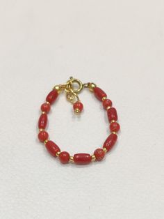 Coral Baby bracelet- Natural Italy Red Coral Lucky Charm Handmade 14k Gold Filled Silver Bracelet for Baby Protection-Baby Shower Gift About Item  .; Adjustable :- 2.5 Inch To 3 Inch Adjustable Stone : Natural Red Coral Weight : 11 Cart Approx. Payment policy We accept the payment via PayPal only. Shipping policy We Ship the item as per our shipping policy once we receive the payment. We understand that getting your items quickly is important to you, so we make every effort to process your orders quickly. Return policy We accept the return within 30 days and item should be return in original condition without any damage and broken. We are continuously adding new products in our shop. So keep coming back to see more great deals on jewelry in our mart For Wholesale orders or custom made orde Gift Red 14k Gold Bracelet, Adjustable Red Stackable Jewelry, Gold Red Coral Bracelets As Gift, Gold Red Coral Bracelets For Gifts, Gold Red Coral Bracelet As A Gift, Gold Red Coral Bracelet For Gift, Gift Jewelry With Hand-strung Red Coral, Gold Bracelets With Red Coral As Gift, Hand-strung Red Coral Jewelry For Gifts