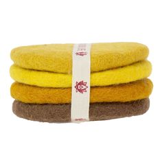 three yellow and brown sponges stacked on top of each other