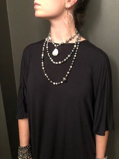 132 South Sea, Tahitian, and Akoya pearls are hand-knotted on silk. A rare “cake-pop” Baroque pearl hangs central to this necklace. Can be worn long, doubled, or three times around the neck. No clasp. 66" with 1.5" drop. South Seas, Cake Pop, Akoya Pearls, Baroque Pearls, Hand Knotted, Silk, Cake